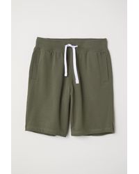 green sweat shorts