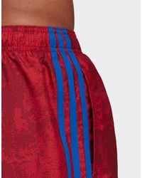 adidas allover print swim shorts