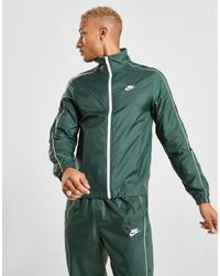 nike woven tracksuit green