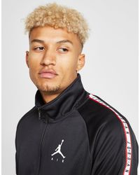 jordan poly tape track top