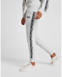 nike pantalon de survêtement tape poly femme nike pantalon de survêtement tape poly femme