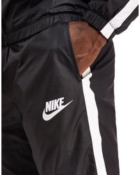 nike woven tracksuit black and white