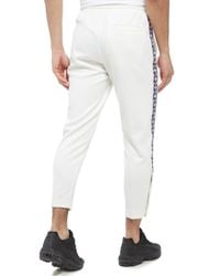 nike taped poly track pants