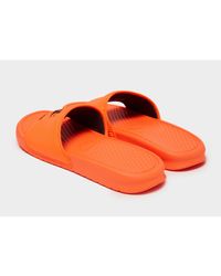 orange and black nike slides