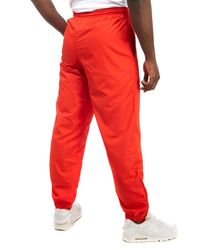 red lacoste track pants