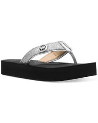 Michael Kors Flip-flops and slides for Women - Up to 31% off at Lyst.com