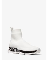 Zapatilla Kendra tipo calcetín de punto elástico Michael Kors de color  Blanco | Lyst
