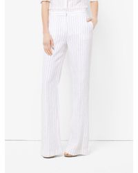 white linen flared trousers
