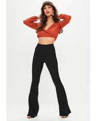 black bandage flared trousers