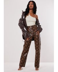 snake print faux leather pants