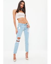 open knee ripped jeans