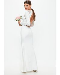 white long sleeve open back dress