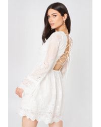 white long sleeve lace mini dress