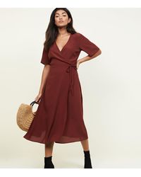 new look midi wrap dress in rust