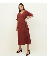 new look midi wrap dress in rust