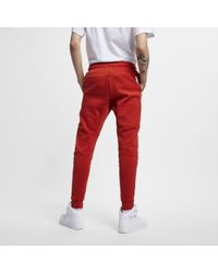 red nike tech tracksuit