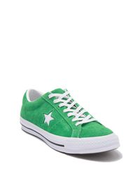 white converse with green stars
