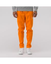 adidas beckenbauer orange pants