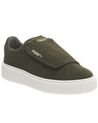 white puma velcro shoes