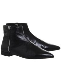 flat pointed black boots