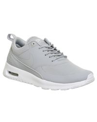 nike black thea trainers