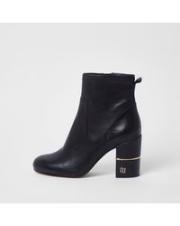 black ankle boots with gold block heel