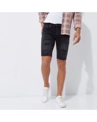black ripped skinny shorts