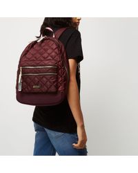 red quilted backpack