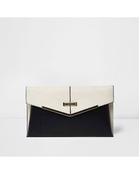 black and cream clutch bag