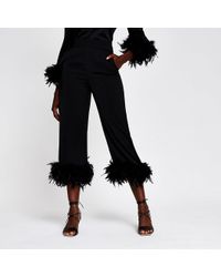 Black feather hem trousers Clearance