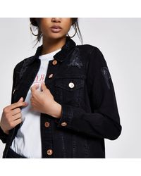 oversized black distressed denim jacket