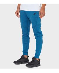 nike tech fleece pants blue and white