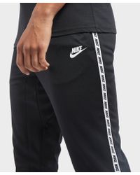nike gel tape cuffed track pants