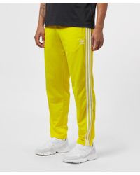 yellow adidas track pants mens