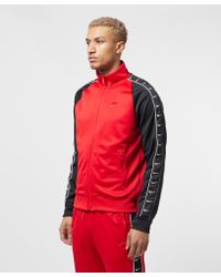 nike tape poly track top