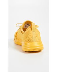 yellow apl sneakers