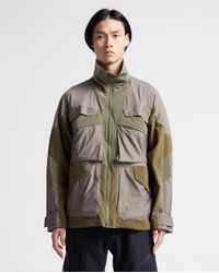 white mountaineering jacket