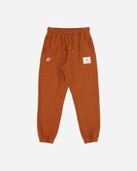 Orange Nike Track pants and sweatpants for Women | Lyst