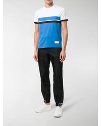 prada rubber tag track pants