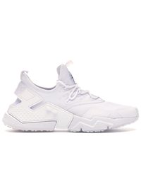 nike huarache drift triple white