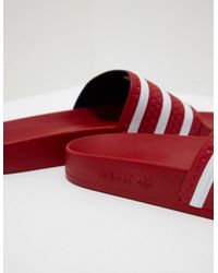 black and red adidas slides