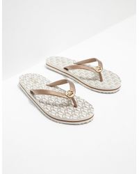 Michael Kors Flip-flops and slides for Women - Up to 58% off at Lyst.com