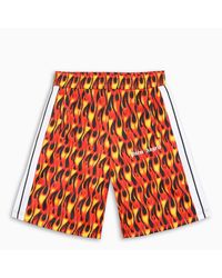Pantaloncino track stampa fiamme di Palm Angels da Uomo | Lyst