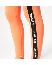 Ivy Park Orange V Active Logo Elastic Tape Tights
