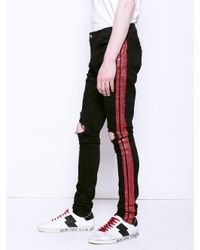 amiri glitter track jeans