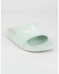 mint green adidas slides