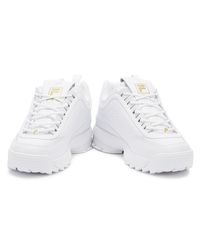 gold fila trainers