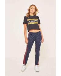 adidas track pants blue with red stripes