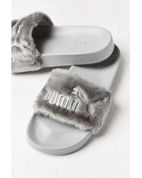 grey fur puma slides