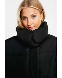 Urban Outfitters Synthetic Uo Black And Orange Contrast Lined Pillow Puffer  Jacket - Lyst